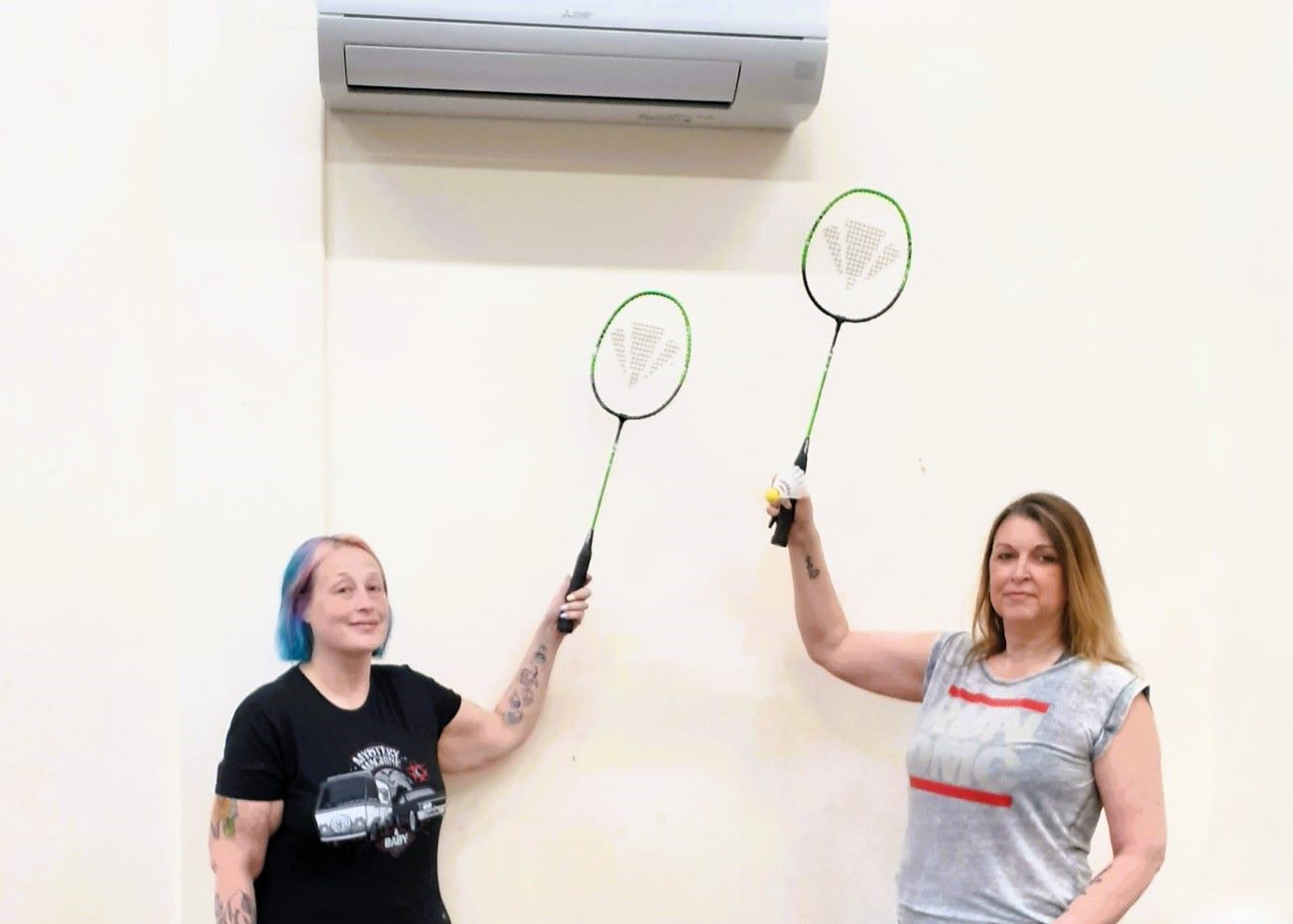 Two members of the Abbotswood Community Association in Hampshire with the newly-installed heating system the fund helped provide