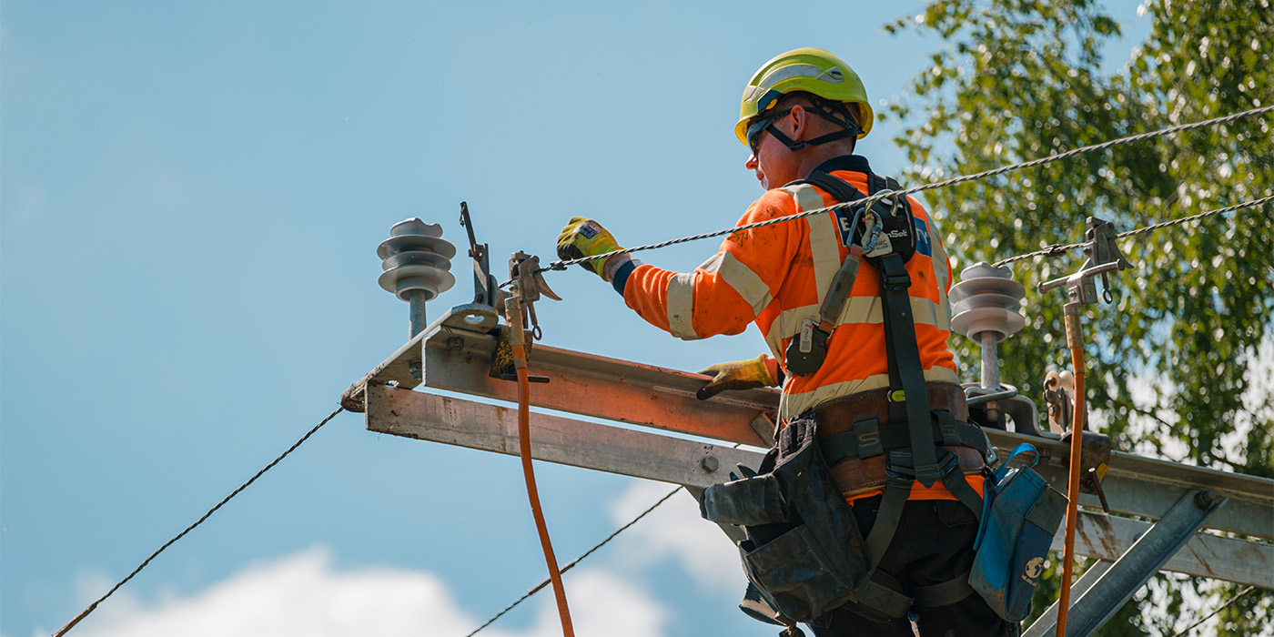 SSEN Distribution linesperson up pole in Banchory