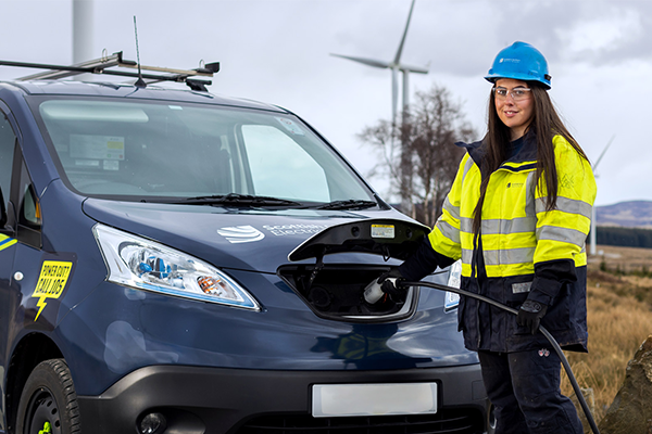 Image of SSEN engineer standing next to electric vehicle 