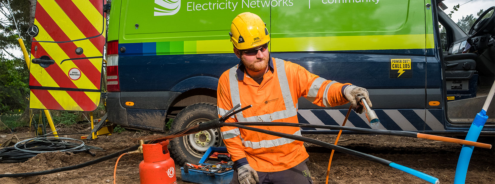 ssen engineer using heat to seal a cable